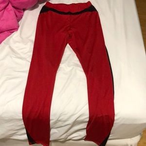 Red and black tights with mesh on leg area